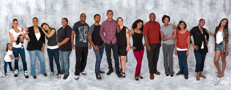 family portrait with photos done over a months time.jpg :: Photos done over time, people in this photo were taken at different times over a months time.  They could not get together at one time so we took everyones photo within that month then put them together to make a very nice family portrait.  Time can be extended until all photos are taken.