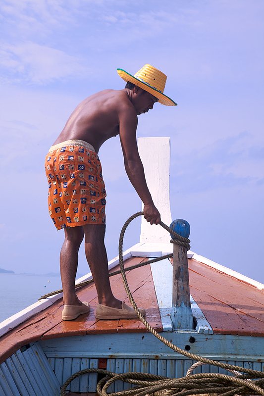 IMG_2097.jpg :: Thai boat captain anchoring the longtail off of Khao Lak, Thailand.