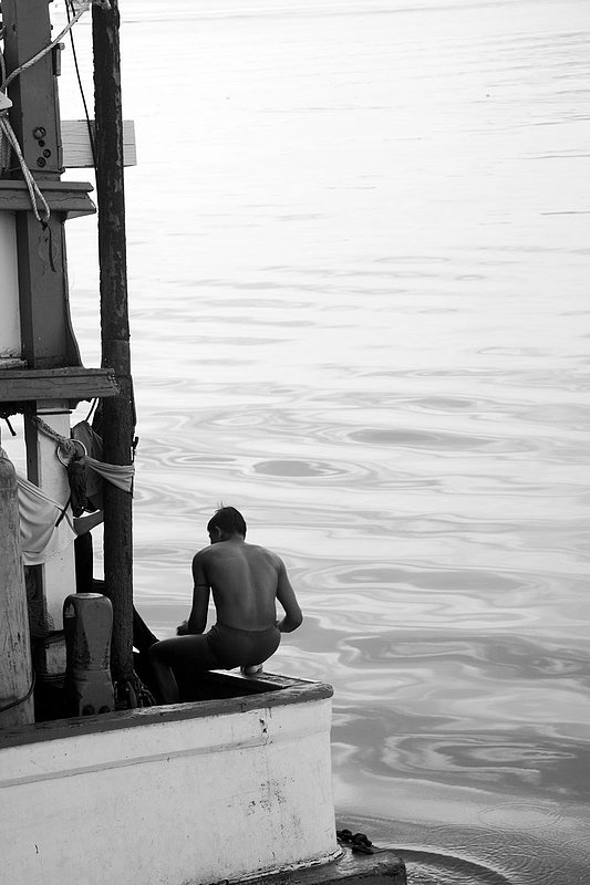 IMG_2136.jpg :: A fisherman bathing on the side of his boat, Khao Lak, Thailand.