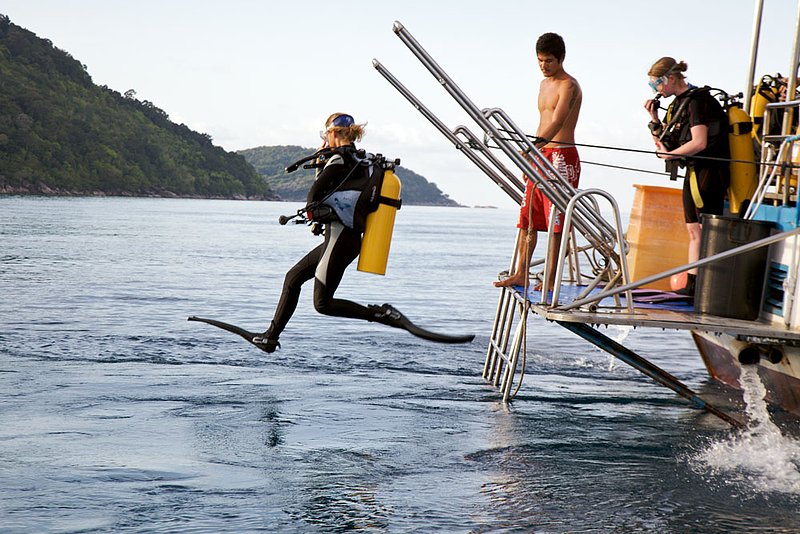 IMG_5791.jpg :: A diver takes a giant stride entry off a liveaboard into the Andaman Sea in the Similan Islands, Thailand.
