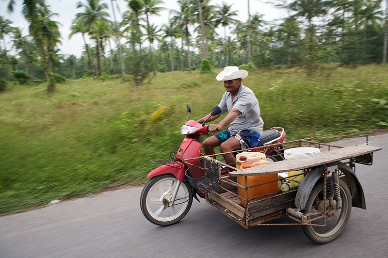 IMG_8323.jpg :: Captain Jack driving a motorbike and a sidecar in Khao Lak, Thailand.