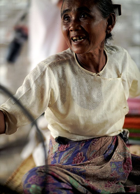 burmese weaver..jpg :: A Burmese woman spinning cloth in Bagan, Myanmar.