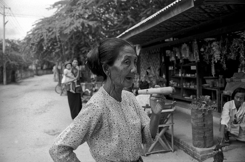 burmesecigarlady.jpg :: An elderly Burmese woman smoking a cigar that she just rolled in Bagan, Myanmar.