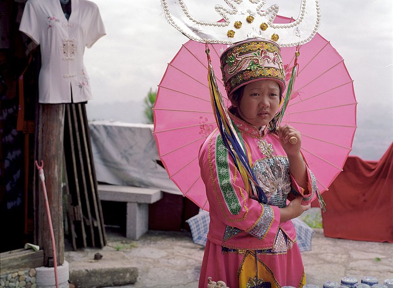 chinesecostumegirl.jpg :: A young Chinese girl dressed in cultural dress, Guilin, China.