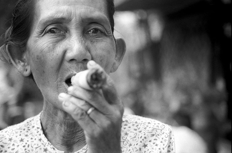 cigarwoman.jpg :: An elderly Burmese woman smoking a cigar that she just rolled in Bagan, Myanmar.