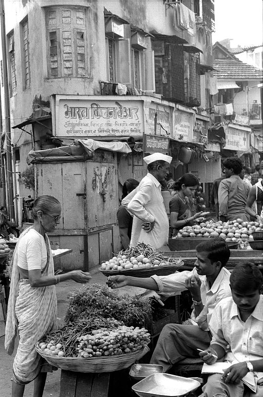 indianwomanbuyingmarket.jpg :: A busy corner market in Mumbai, India.