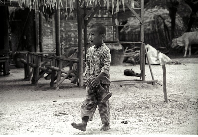 littledrummerboy.jpg :: A Burmese boy plays his drum through his village in Bagan, Myanmar.