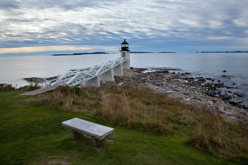 ME072.jpg :: A memorial bench marks the way towards the Marshall Point Lighthouse and it's neighboring Atlantic Ocean

Port Clyde ME - Fall 2010