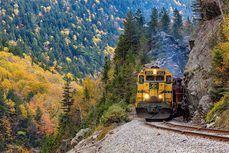 NH063.jpg :: Conway Railroad passing thru rock formation on way to Crawford Notch Depot

Carroll NH - Fall 2023
