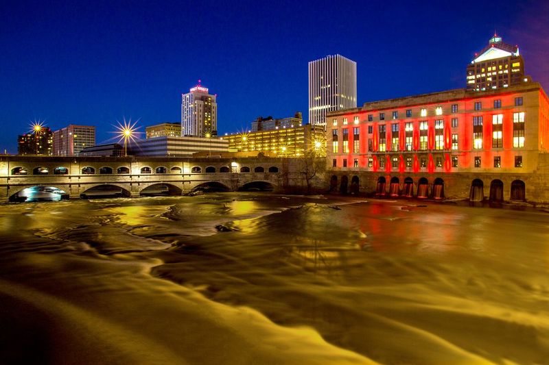 NY467.jpg :: Aqueduct area along the Genesee River with the Rundle Library decked out in red

Rochester NY - Fall 2015