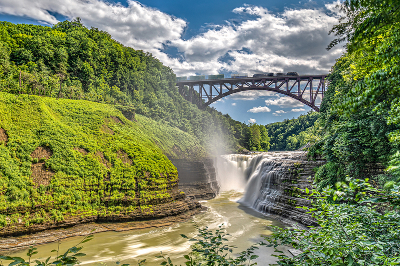 NY702.jpg :: Letchworth State Park's upper falls with train riding across the new train trestle

Letchworth State Park - Summer 2019