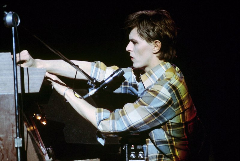 Bowie-Iggy  117.jpg :: Bowie agreed to tour & play keyboards on Iggy's 1977 tour..trying to get a good photo of Bowie on stage was difficult as he sat way off to the side & in the dark..it was Iggy's show anyway, but the lights finally came down on Bowie at the very end...