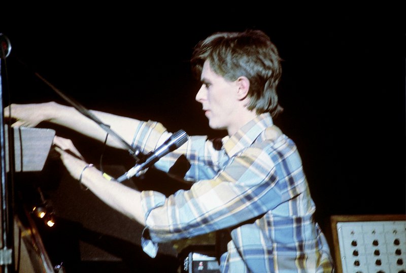 Bowie-Iggy  118.jpg :: Bowie agreed to tour & play keyboards on Iggy's 1977 tour..trying to get a good photo of Bowie on stage was difficult as he sat way off to the side & in the dark..it was Iggy's show anyway, but the lights finally came down on Bowie at the very end...