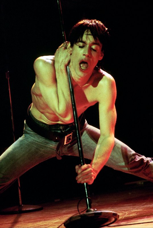 Iggy 4-13-77  105.jpg :: Bowie agreed to tour & play keyboards on Iggy's 1977 tour..trying to get a good photo of Bowie on stage was difficult as he sat way off to the side & in the dark..it was Iggy's show anyway, but the lights finally came down on Bowie at the very end...