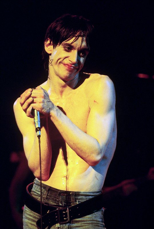 Iggy 4-13-77  106.jpg :: Bowie agreed to tour & play keyboards on Iggy's 1977 tour..trying to get a good photo of Bowie on stage was difficult as he sat way off to the side & in the dark..it was Iggy's show anyway, but the lights finally came down on Bowie at the very end...