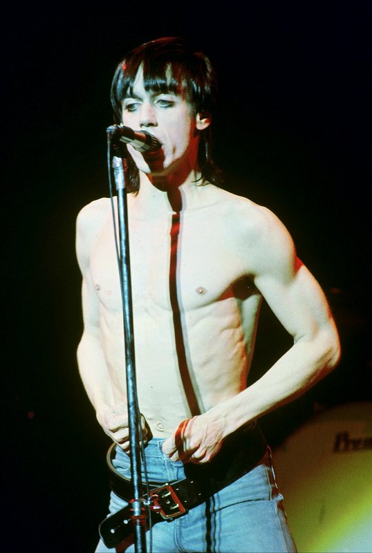 Iggy 4-13-77  107.jpg :: Bowie agreed to tour & play keyboards on Iggy's 1977 tour..trying to get a good photo of Bowie on stage was difficult as he sat way off to the side & in the dark..it was Iggy's show anyway, but the lights finally came down on Bowie at the very end...