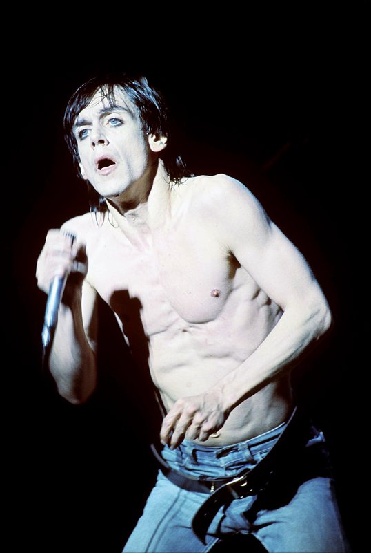 Iggy 4-13-77  108.jpg :: Bowie agreed to tour & play keyboards on Iggy's 1977 tour..trying to get a good photo of Bowie on stage was difficult as he sat way off to the side & in the dark..it was Iggy's show anyway, but the lights finally came down on Bowie at the very end...