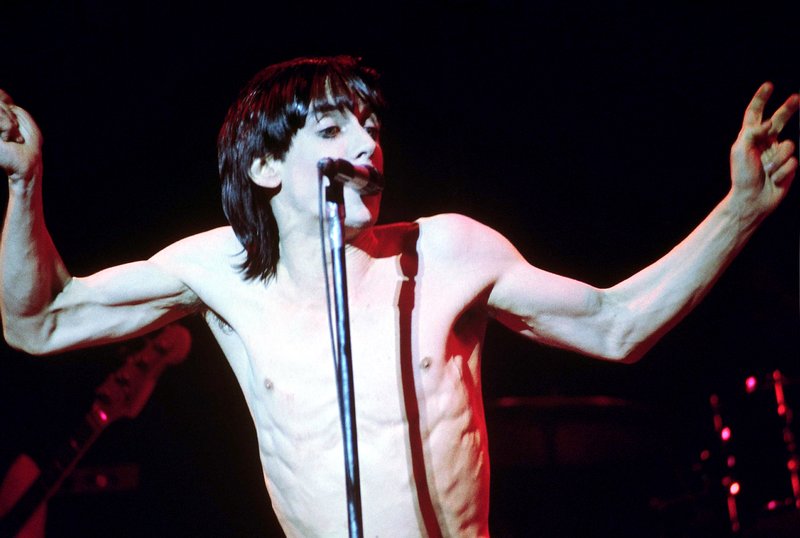 Iggy 4-13-77  110.jpg :: Bowie agreed to tour & play keyboards on Iggy's 1977 tour..trying to get a good photo of Bowie on stage was difficult as he sat way off to the side & in the dark..it was Iggy's show anyway, but the lights finally came down on Bowie at the very end...