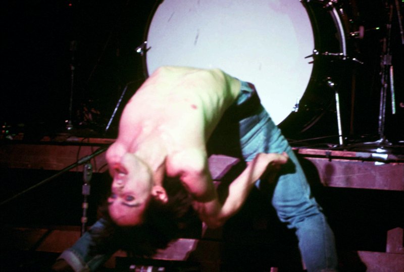 Iggy 4-13-77  116.jpg :: Bowie agreed to tour & play keyboards on Iggy's 1977 tour..trying to get a good photo of Bowie on stage was difficult as he sat way off to the side & in the dark..it was Iggy's show anyway, but the lights finally came down on Bowie at the very end...