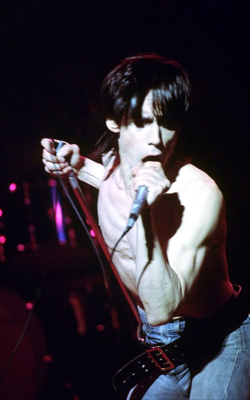 Iggy 4-13-77 114.jpg :: Bowie agreed to tour & play keyboards on Iggy's 1977 tour..trying to get a good photo of Bowie on stage was difficult as he sat way off to the side & in the dark..it was Iggy's show anyway, but the lights finally came down on Bowie at the very end...