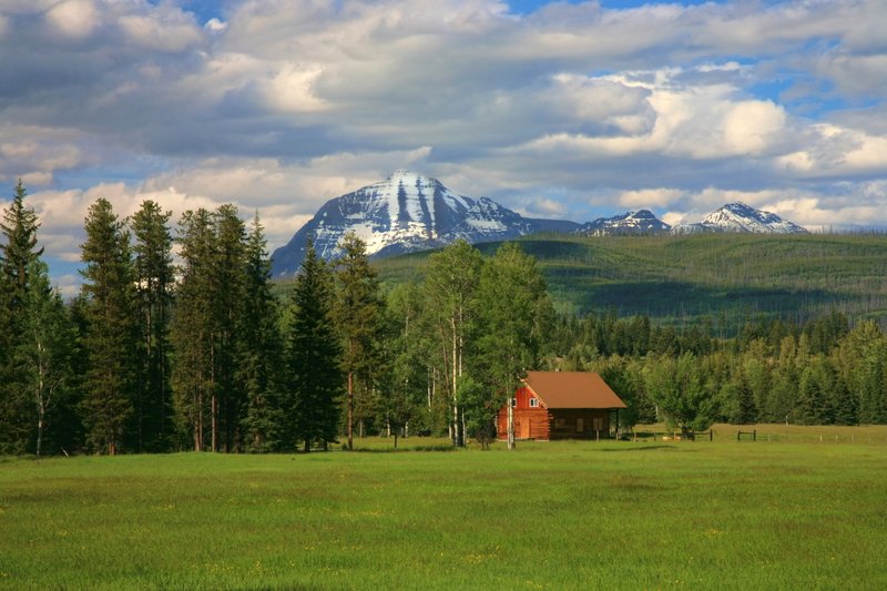 IMG_0249.jpg :: This beautiful historic cabin sits in a meadow with Rainbow Peak in the background, near Polebridge, Montana