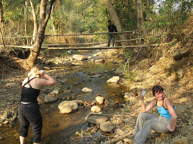 R56.jpg :: After a long day trekking, a splash around in the cool mountain water is very refreshing.