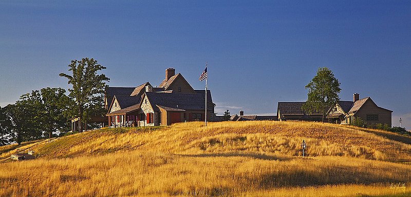 E101--0079  V1  1500px  SS - with signature.jpg :: One of the cabins at Erin Hills, a daily fee golf course in Erin, Wisconsin.  Erin Hills was designed by Hurdzan/Fry and Ron Whitten and built by Landscapes Unlimited, LLC, and has been choosen to host the 2011 US Amateur Chanpionship and the 2017 US Open Championship.  Photo by Paul Hundley; taken in July, 2012.