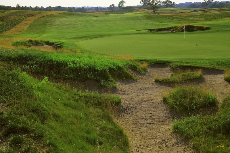 E101--0554  1200px with signature  V1  SS.jpg :: The par 4 fifth hole at Erin Hills.  Erin Hills is a daily fee golf course in Erin, Wisconsin.  It was designed by Hurdzan/Fry Designs and Ron Whitten and built by Landscapes Unlimited, LLC.  Photograph by Paul Hundley; July, 2011.
