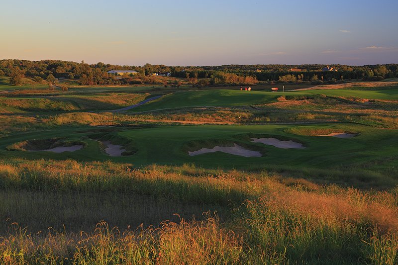 E101--0950  1200px  V0  SS.jpg :: The 9th hole (with the 18th green in the background) at Erin Hills.  Erin Hills is a daily fee golf course in Erin, Wisconsin.  It was designed by Hurdzan/Fry Designs and Ron Whitten and built by Landscapes Unlimited, LLC.  September, 2010.  PM shoot.  Photo by Paul Hundley.