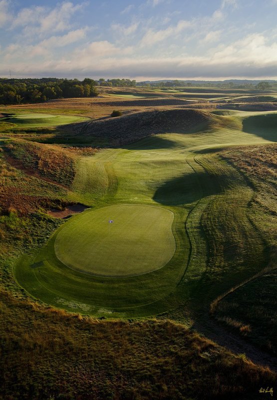 E101--1259  V1  1500px  with signature  SS1.jpg :: The roller-coaster par four 12th hole with the tees in the upper right (and the 13th green in the upper left) at Erin Hills, a daily fee golf course in Erin, Wisconsin.  Erin Hills was designed by Hurdzan/Fry and Ron Whitten and built by Landscapes Unlimited, LLC, and has been choosen to host the 2011 US Amateur Chanpionship and the 2017 US Open Championship.  Photo by Paul Hundley; taken in September, 2012.