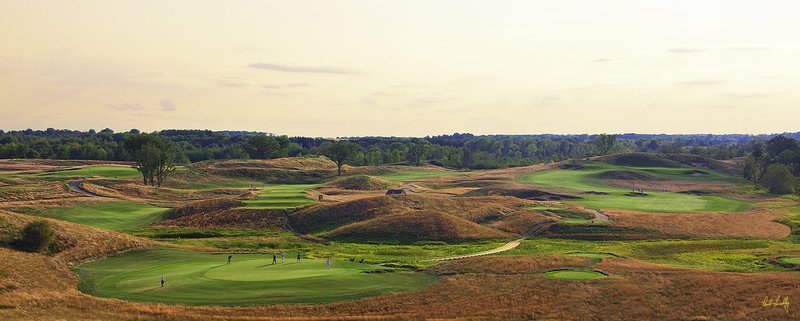 E101--1362  V1  1500px  SS - with signature.jpg :: The par three 13th hole (left) and par 5 14th hole (right) at Erin Hills, a daily fee golf course in Erin, Wisconsin.  Erin Hills was designed by Hurdzan/Fry and Ron Whitten and built by Landscapes Unlimited, LLC, and has been choosen to host the 2011 US Amateur Chanpionship and the 2017 US Open Championship.  Photo by Paul Hundley; taken in September, 2012.