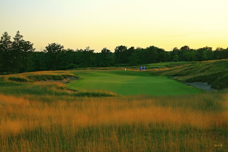 E101--1651  1200px with signature  V1  SS.jpg :: The par 3 sixteenth hole at Erin Hills.  Erin Hills is a daily fee golf course in Erin, Wisconsin.  It was designed by Hurdzan/Fry Designs and Ron Whitten and built by Landscapes Unlimited, LLC.  Photograph by Paul Hundley; July, 2011.