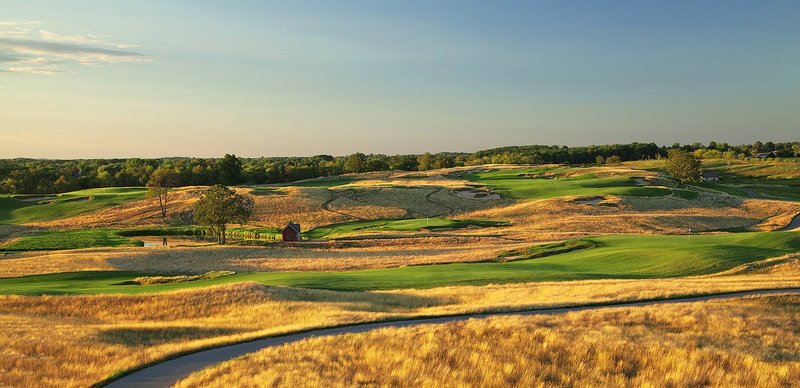 E101--1862  V1  1500px  SS - with signature.jpg :: The par five18th hole (foreground), the par 3 9th hole (left), and the par 4 10th hole (right) at Erin Hills, a daily fee golf course in Erin, Wisconsin.  Erin Hills was designed by Hurdzan/Fry and Ron Whitten and built by Landscapes Unlimited, LLC, and has been choosen to host the 2011 US Amateur Chanpionship and the 2017 US Open Championship.  Photo by Paul Hundley; taken in August, 2012.