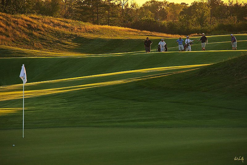 E101--Caddies-015  V1  1500px  SS - with signature.jpg :: Caddies and players at Erin Hills, a daily fee golf course in Erin, Wisconsin.  Erin Hills was designed by Hurdzan/Fry and Ron Whitten and built by Landscapes Unlimited, LLC, and has been choosen to host the 2011 US Amateur Chanpionship and the 2017 US Open Championship.  Photo by Paul Hundley; taken in September, 2012.