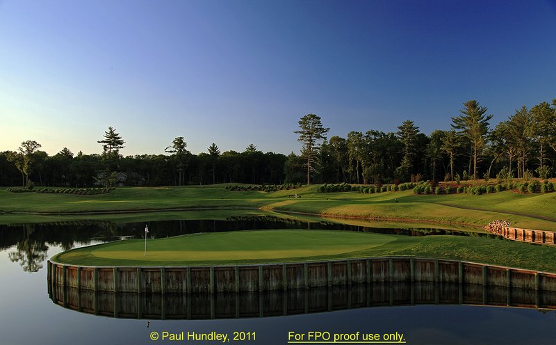 FPO proof - N103--1050-05  12x18  aRGB 5DMk2-16  RAW.jpg :: The par 3 tenth hole at The Castle Course at Northern Bay Resort, a public resort golf club located in Arkdale, WIsconsin.  The Castle Course is a mix of original holes and replicas of some of America's most famous golf holes.  This hole is a replica of the seventeenth hole at the TPC at Sawgrass.  June,  2011; PM shoot.  Photograph by Paul Hundley.