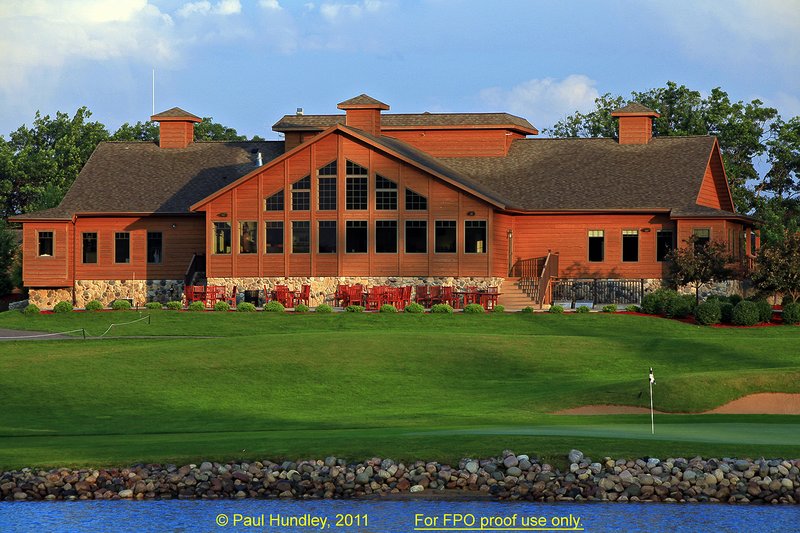 FPO proof - N103--1860-02  12x18  aRGB 5DMk2-16  RAW.jpg :: The clubhouse sits above the green on the par 5 finishing hole at The Castle Course at Northern Bay Resort, a public resort golf club located in Arkdale, WIsconsin.  The Castle Course is a mix of original holes and replicas of some of America's most famous golf holes.  The eighteenth is a replica of the eighteenth hole at Arnold Palmer's Bay Hill Club.  June,  2011; AM shoot.  Photograph by Paul Hundley.