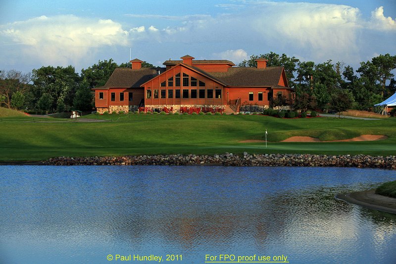 FPO proof - N103--1861-02  12x18  aRGB 5DMk2-16  RAW.jpg :: The clubhouse sits above the green on the par 5 finishing hole at The Castle Course at Northern Bay Resort, a public resort golf club located in Arkdale, WIsconsin.  The Castle Course is a mix of original holes and replicas of some of America's most famous golf holes.  The eighteenth is a replica of the eighteenth hole at Arnold Palmer's Bay Hill Club.  June,  2011; AM shoot.  Photograph by Paul Hundley.