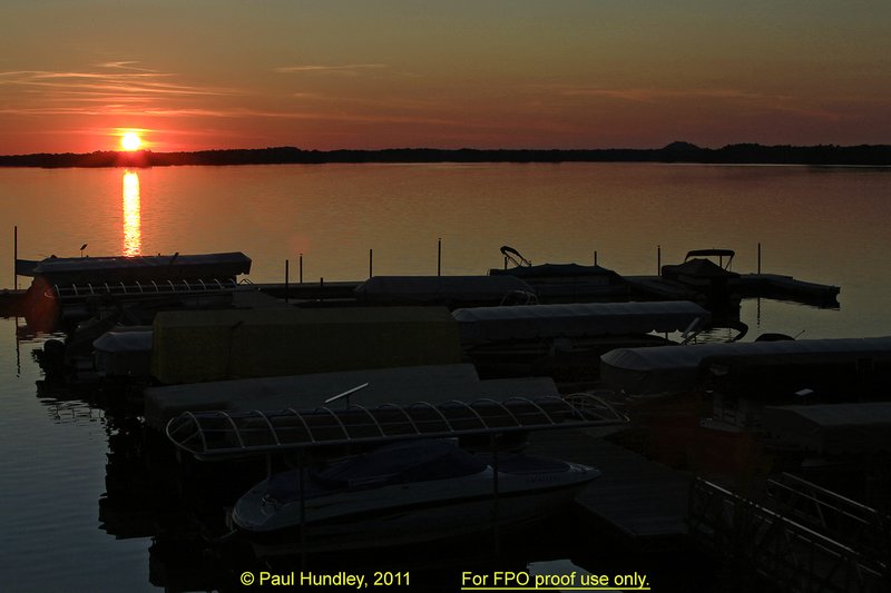 N103--0050  FPO proof.jpg :: Summer sunset over the marina at Northern Bay Resort located in Arkdale, WIsconsin.  Northern Bay Resort is also the home of The Castle Course, public golf course which is a mix of original holes and replicas of some of America's most famous golf holes.  June,  2011; PM shoot.  Photograph by Paul Hundley.