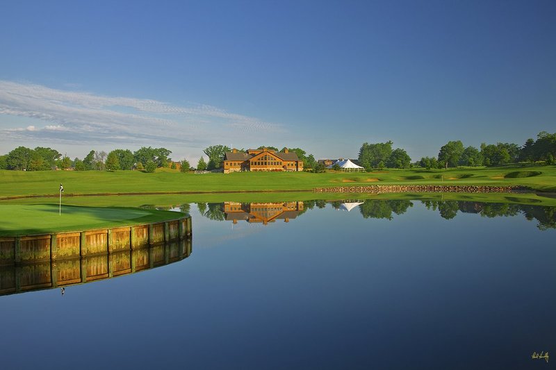 N103--1052  V1  1500px  SS (with signature).jpg :: The par 3 tenth hole at The Castle Course at Northern Bay Resort, a public resort golf club located in Arkdale, WIsconsin.  The Castle Course is a mix of original holes and replicas of some of America's most famous golf holes.  This hole is a replica of the seventeenth hole at the TPC at Sawgrass.  June,  2011; AM shoot.  Photograph by Paul Hundley.