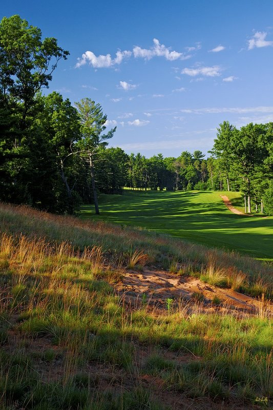N103--1554  V1  1500px  SS (with signature).jpg :: The par 5 fifteenth hole at The Castle Course at Northern Bay Resort, a public resort golf club located in Arkdale, WIsconsin.  The Castle Course is a mix of original holes and replicas of some of America's most famous golf holes.  June,  2011; AM shoot.  Photograph by Paul Hundley.