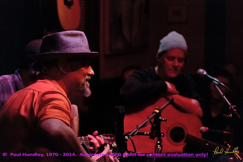 Approval proof - Peter Paul and Willy at Cafe Carpe by Paul Hundley - 15 - 02.jpg :: Paul Cebar and Willy Porter (left to right) perform (along with Peter Mulvey, hidden) together for the first time to a sellout audience of 70 at the Cafe Carpe in Fort Atkinson, Wisconsin.  December 10, 2014.  Photograph by Paul Hundley