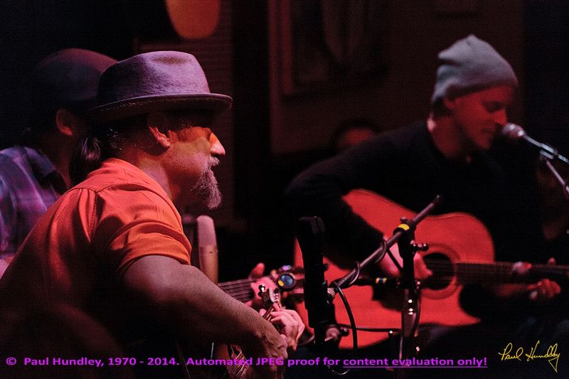 Approval proof - Peter Paul and Willy at Cafe Carpe by Paul Hundley - 15 - 03.jpg :: Paul Cebar and Willy Porter (left to right) perform (along with Peter Mulvey, hidden) together for the first time to a sellout audience of 70 at the Cafe Carpe in Fort Atkinson, Wisconsin.  December 10, 2014.  Photograph by Paul Hundley