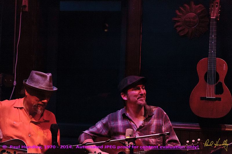 Approval proof - Peter Paul and Willy at Cafe Carpe by Paul Hundley - 60.jpg :: Paul Cebar and Peter Mulvey (left to right) perform (with Willy Porter, not shown) together for the first time to a sellout audience of 70 at the Cafe Carpe in Fort Atkinson, Wisconsin.  December 10, 2014.  Photograph by Paul Hundley