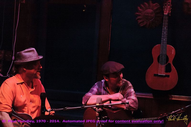 Approval proof - Peter Paul and Willy at Cafe Carpe by Paul Hundley - 61.jpg :: Paul Cebar and Peter Mulvey (left to right) perform (with Willy Porter, not shown) together for the first time to a sellout audience of 70 at the Cafe Carpe in Fort Atkinson, Wisconsin.  December 10, 2014.  Photograph by Paul Hundley