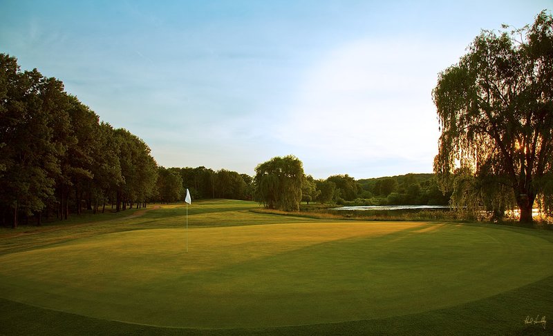 C112a--0450  V1  1200px with signature  SS.jpg :: The 4th hole on the Oaks Course at Christmas Village Resort in Wisconsin Dells, Wisconsin.  Christmas Village Resort is a 1400 acre resort development which includes 27 holes of golf.  Photograph by Paul Hundley; June, 2013