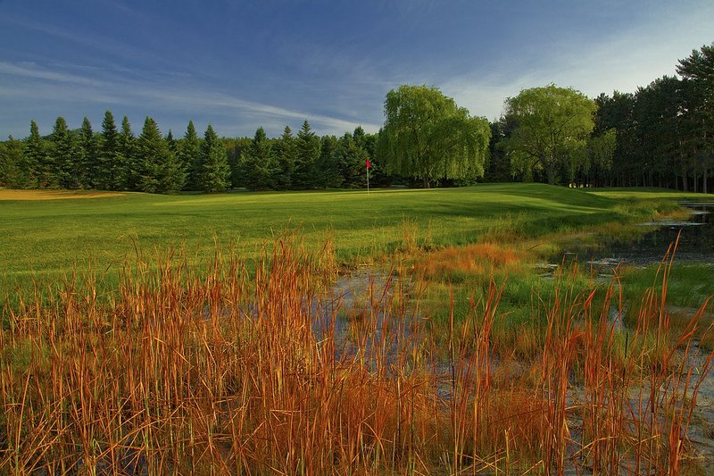 C112b--0650  V1  1200px with signature  SS.jpg :: The par 4 sixth hole on the Pines Course at Christmas Village Resort in Wisconsin Dells, Wisconsin.  Christmas Village Resort is a 1400 acre resort development which includes 27 holes of golf.  Photograph by Paul Hundley; June, 2013