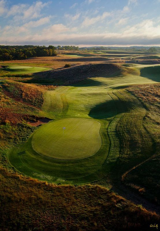 E101--1259  V1  1500px  with signature  SS.jpg :: The roller-coaster par four 12th hole with the tees in the upper right (and the 13th green in the upper left) at Erin Hills, a daily fee golf course in Erin, Wisconsin.  Erin Hills was designed by Hurdzan/Fry and Ron Whitten and built by Landscapes Unlimited, LLC, and has been choosen to host the 2011 US Amateur Chanpionship and the 2017 US Open Championship.  Photo by Paul Hundley; taken in September, 2012.