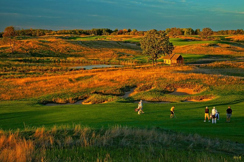 E101--Players 057  V1  1200px  SS.jpg :: Players on the par five 18th hole at Erin Hills, a daily fee golf course in Erin, Wisconsin.  Erin Hills was designed by Hurdzan/Fry and Ron Whitten and built by Landscapes Unlimited, LLC, and has been choosen to host the 2011 US Amateur Chanpionship and the 2017 US Open Championship.  Photo by Paul Hundley; taken in September, 2013.