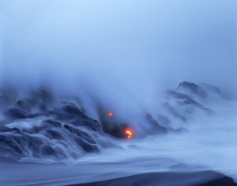 GBL-VLO-13.jpg :: Misty view of lava falling into the sea at the rocky shores of Hawaii Volcanoes National Park