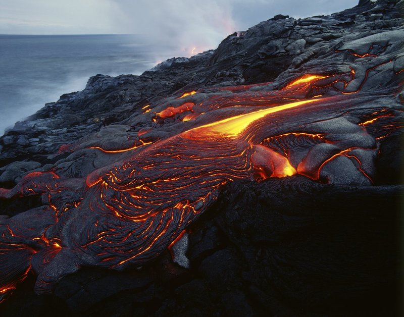 GBL-VLO-15.jpg :: Vibrant lava solidifies on a rocky shore of Hawaiʻi Volcanoes National Park